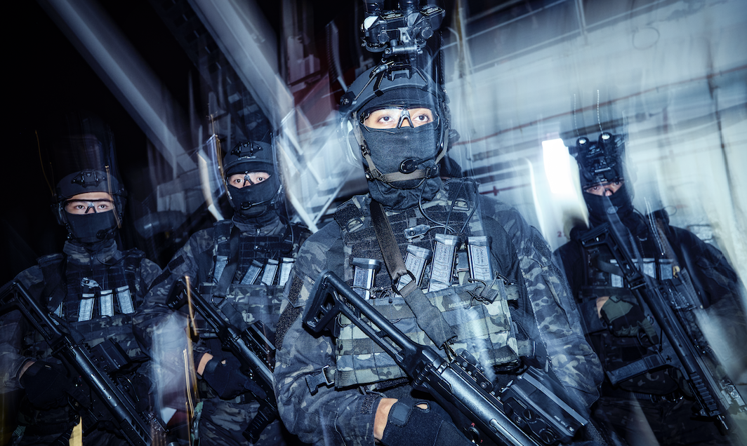 Four naval divers in tactical gear